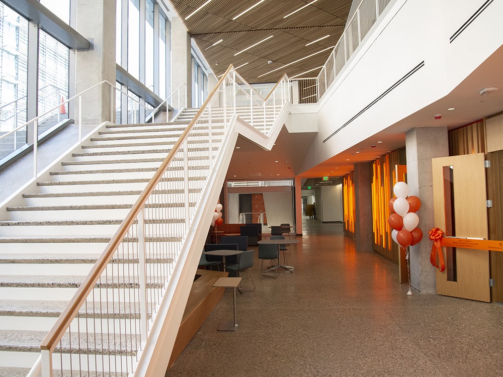 GLT building stairs with orange and white balloon decorations