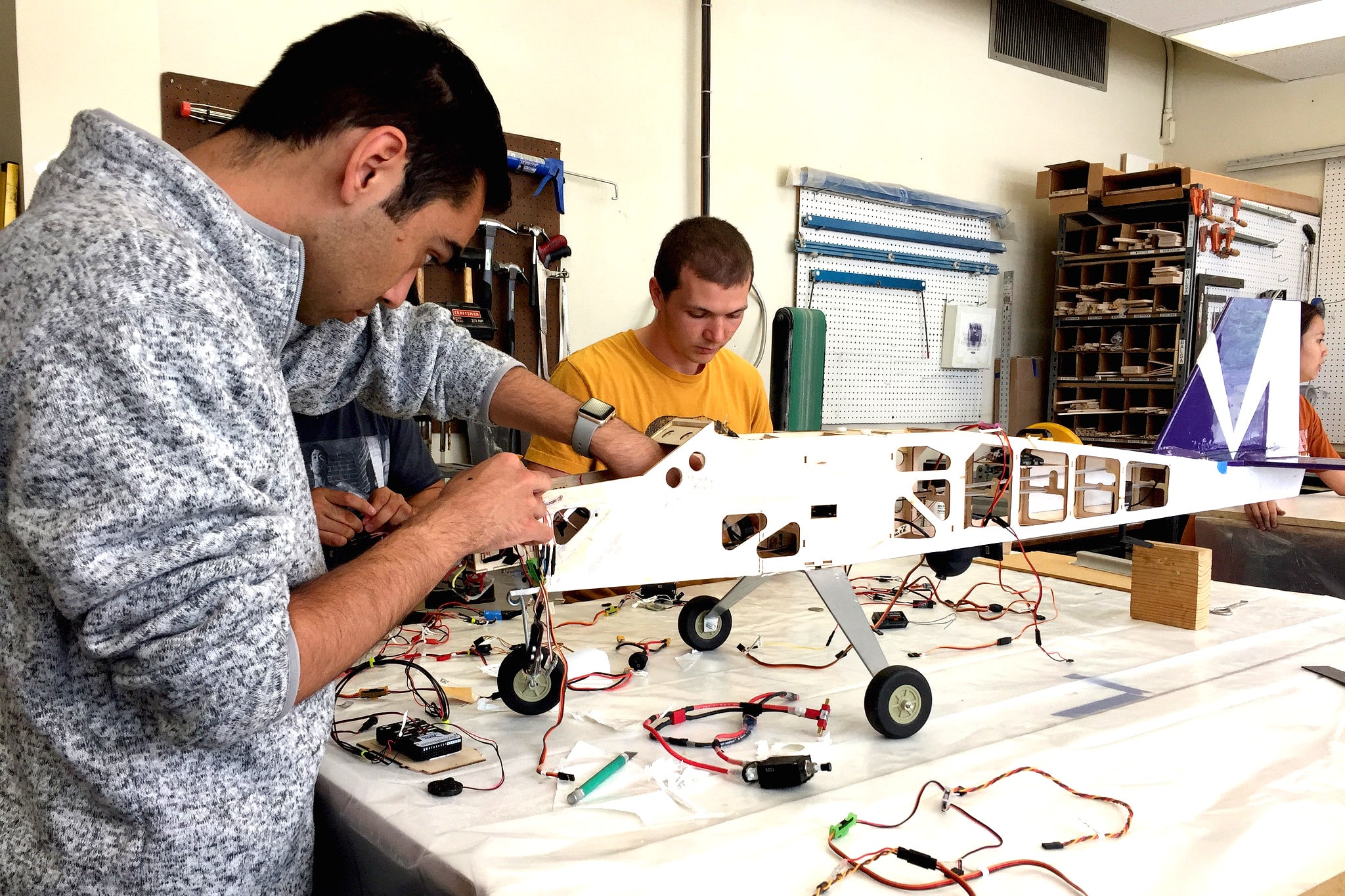 Texas aerospace engineering students working on a rocket model